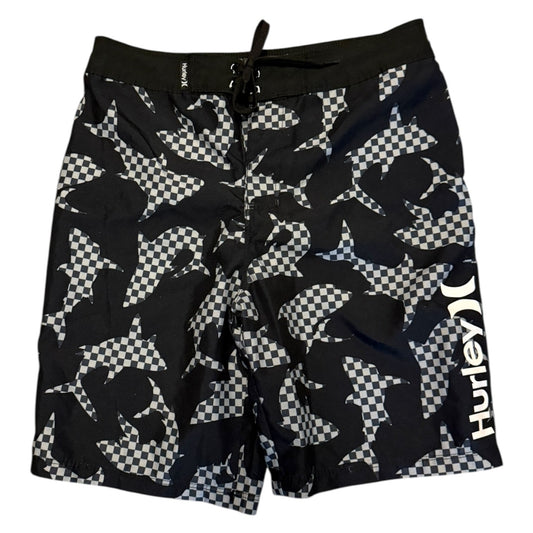 Black and white checkered shark patterned shorts on a white background