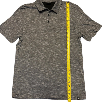 Black white polo shirt with a measuring tape on a white background