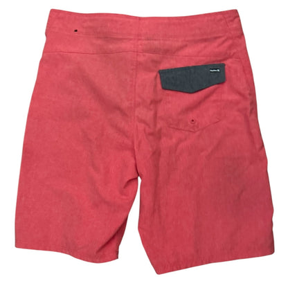 Red shorts with a gray pocket on a white background