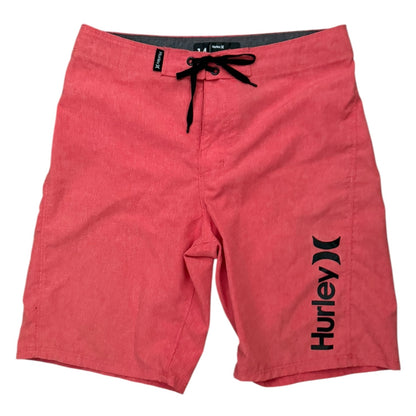 Red Hurley shorts on a white background