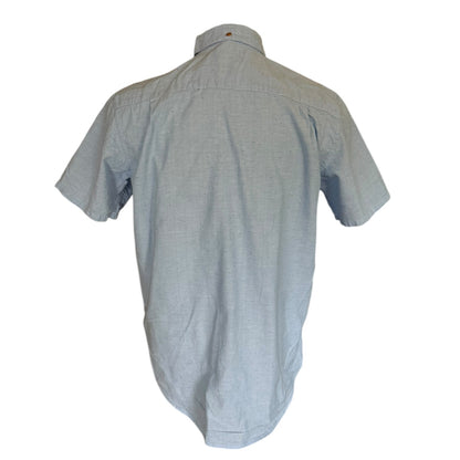 Back view of a light blue shirt on a white background