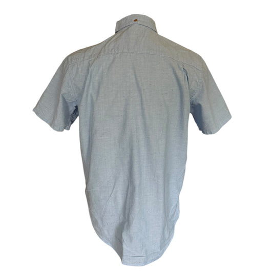 Back view of a light blue shirt on a white background