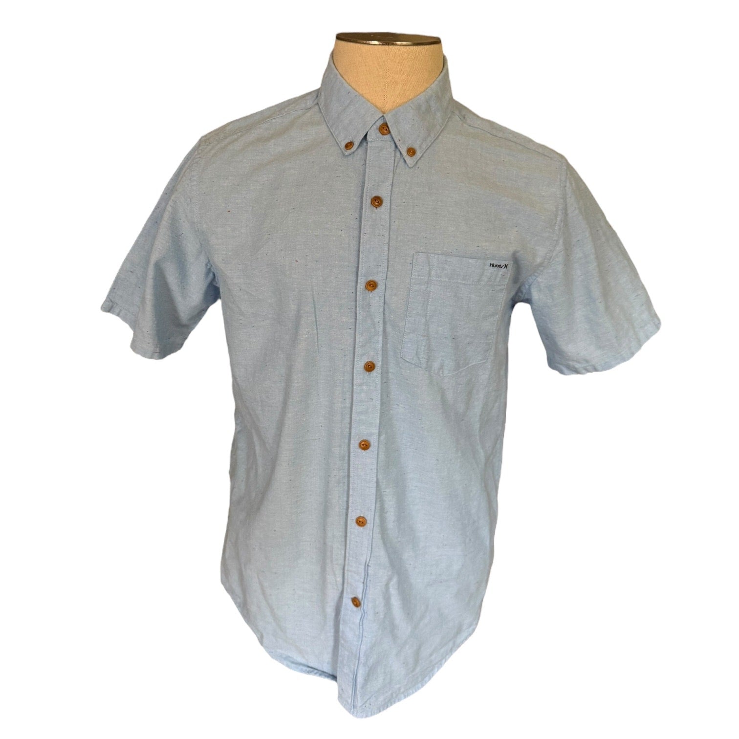 Light blue short-sleeve shirt on a mannequin with a white background