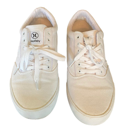 Front of white sneakers with white laces and Hurley logo on a white background