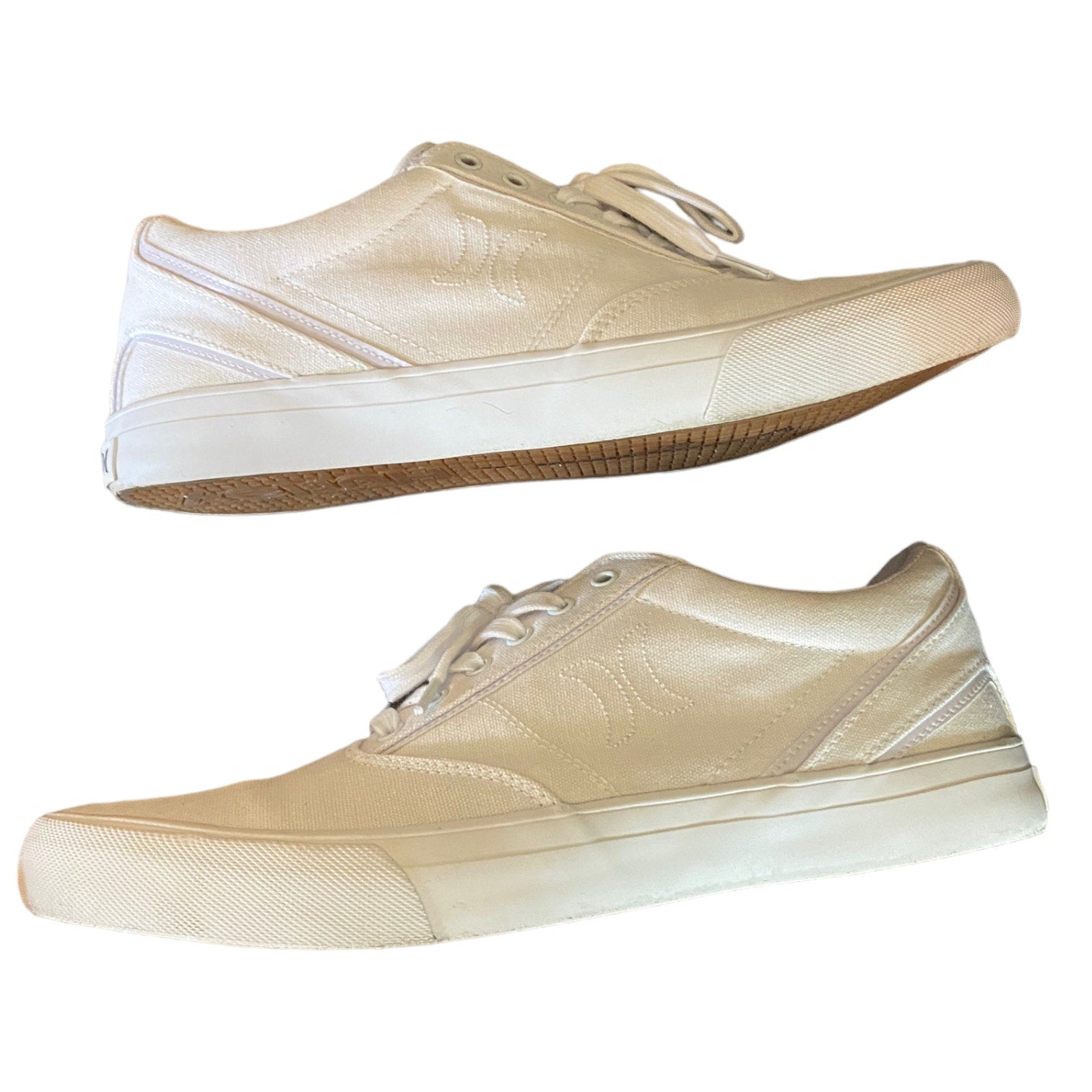 Side view of white sneakers on a white background