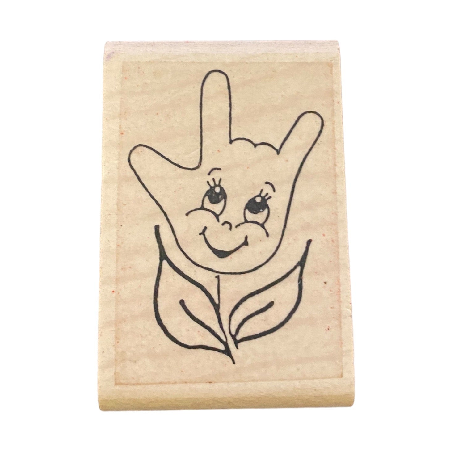 Rubber stamp with a design of a hand and leaf on a white background