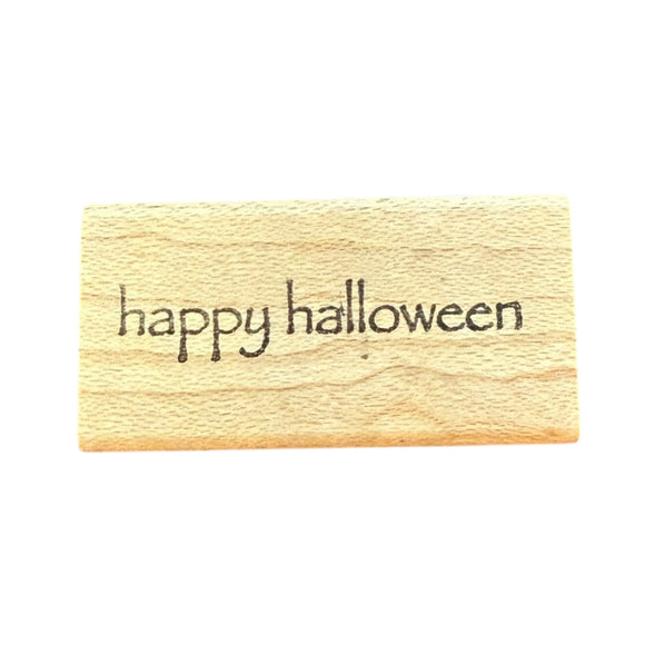 Wooden stamp with 'happy halloween' text on a white background