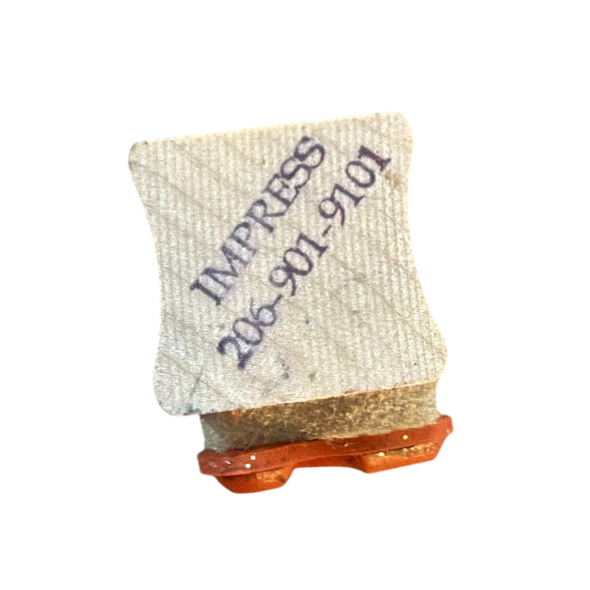 A small square rubber stamp with dark printed text reading 'IMPRESS 206-901-9101', shown on a plain white background.