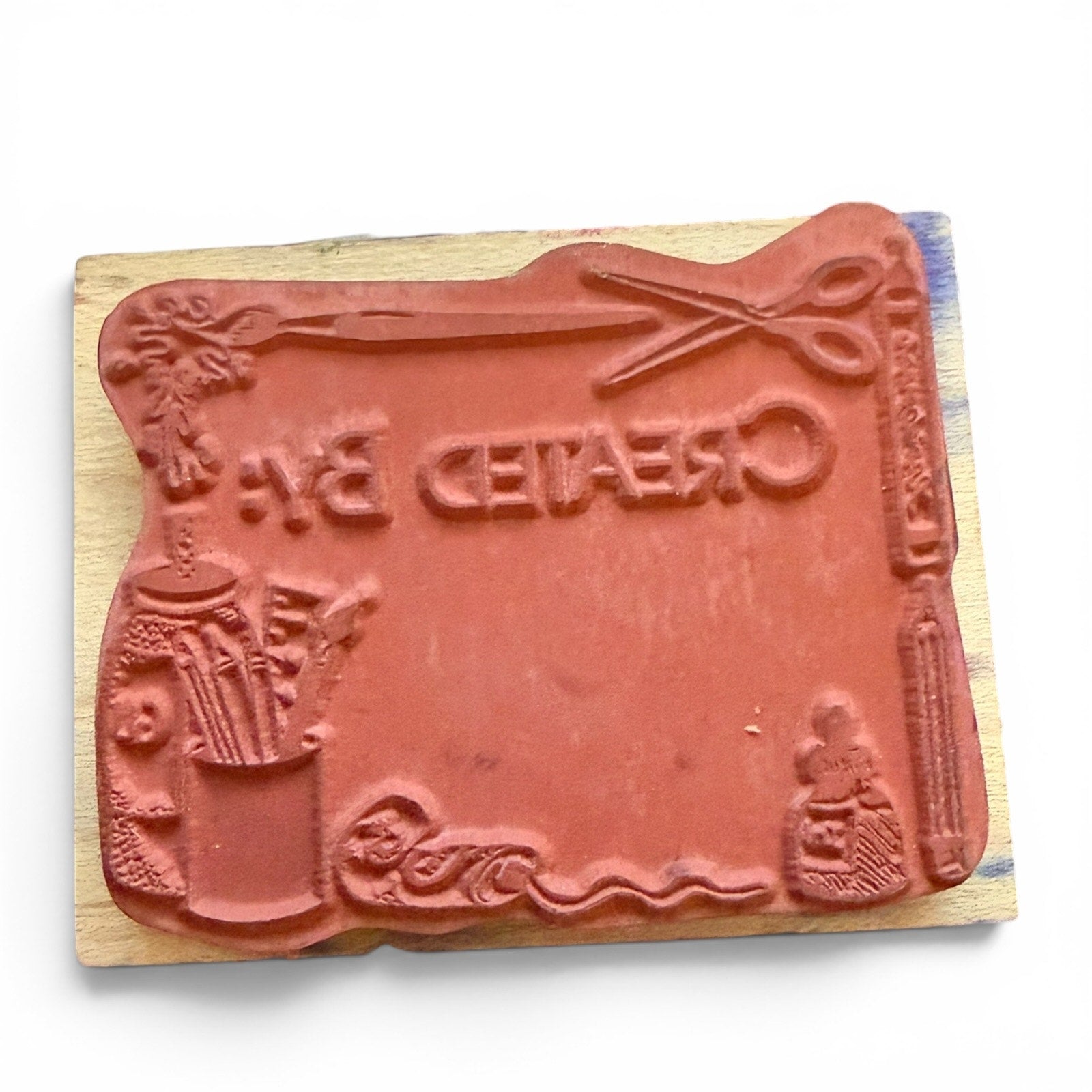 Decorative stamp with design on a wooden block