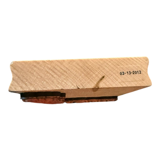 Wood Block with a date stamp on a white background