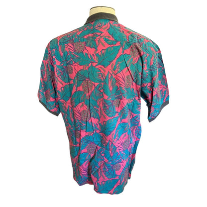 Mannequin wearing a colorful floral-patterned jacket on a white background