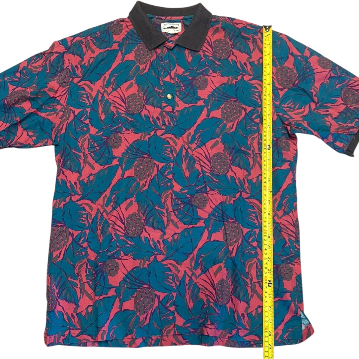 Floral patterned shirt with a measuring tape on a white background