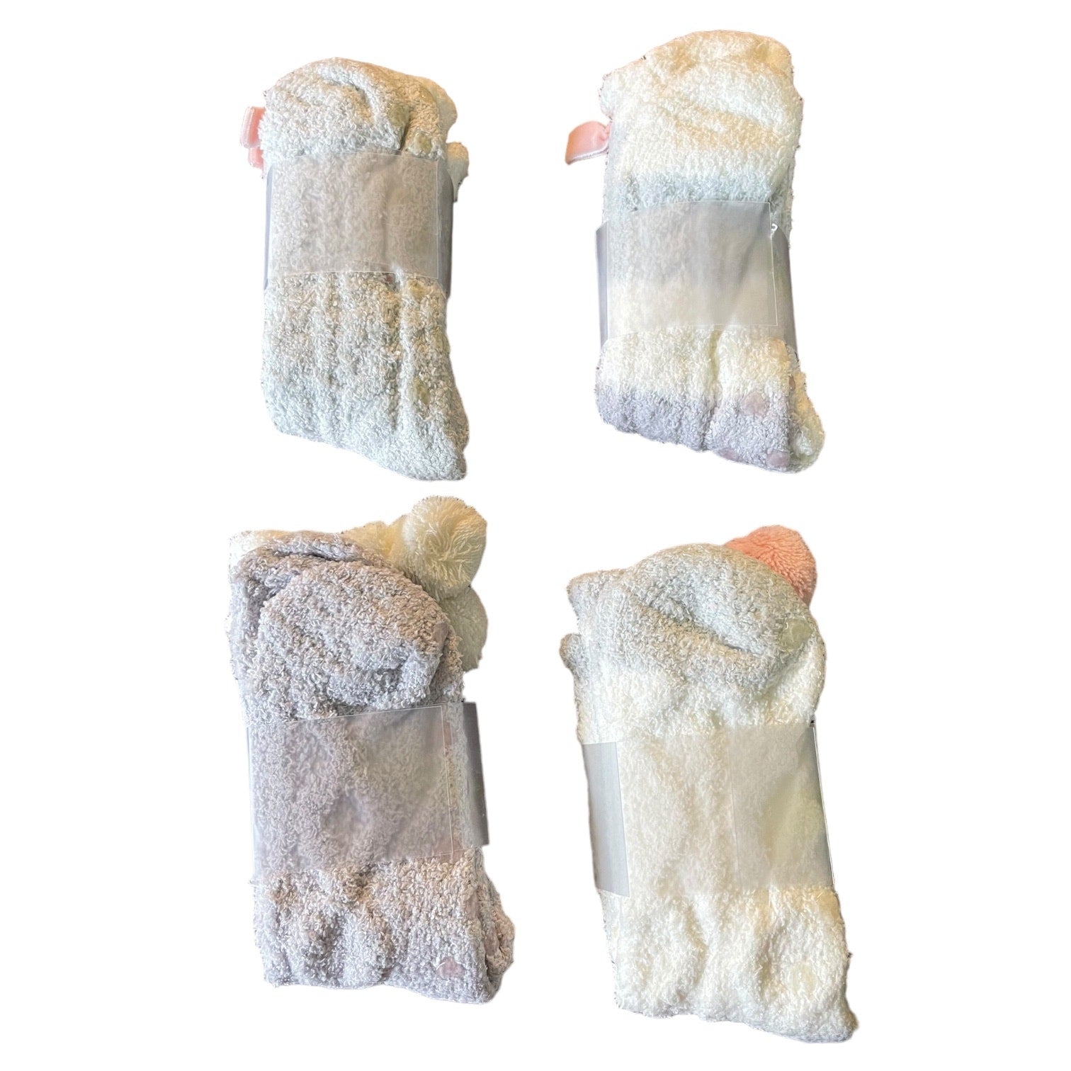 Four pairs of white socks on a white background