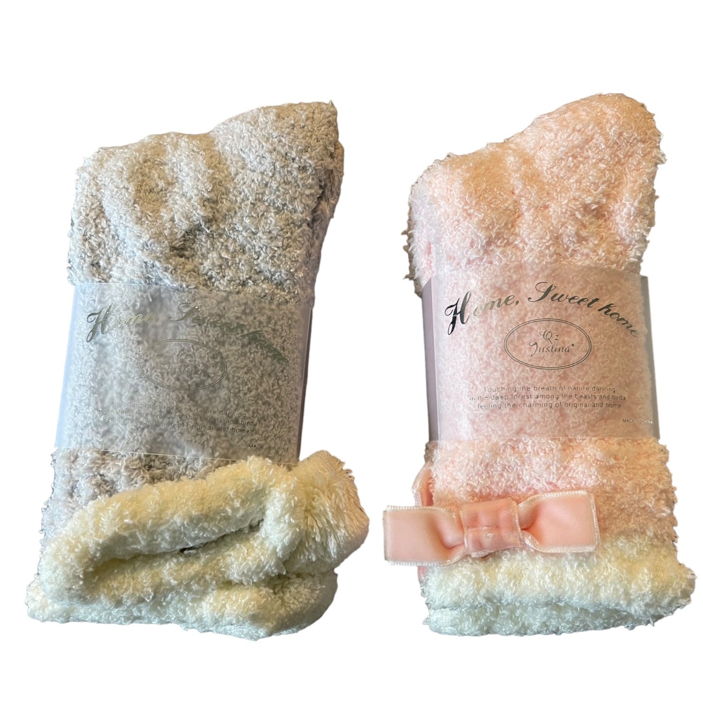 Two pairs of multicolor fuzzy socks on a white background