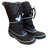 Pair of black winter boots with fur lining on a white background