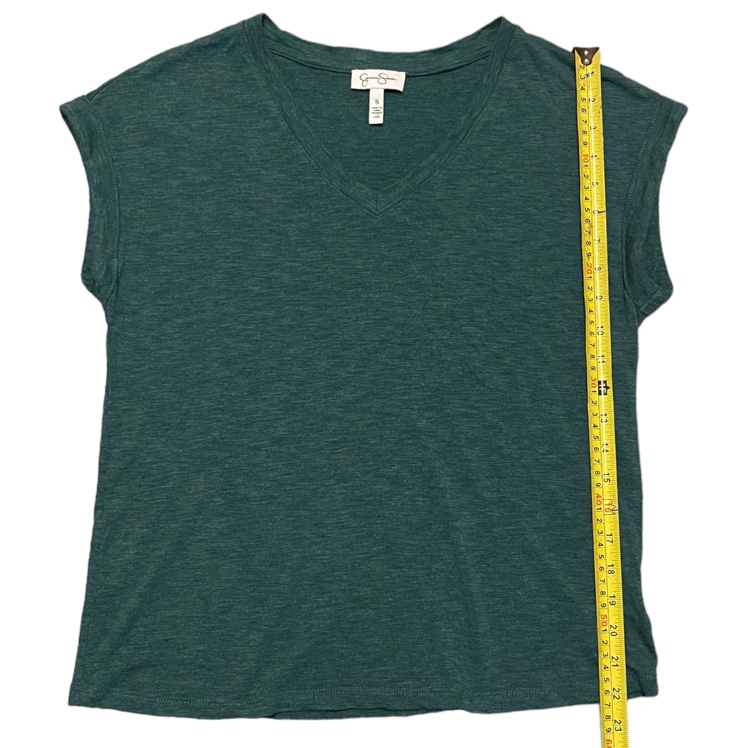 A dark green V-neck short-sleeve top with a yellow measuring tape running vertically along the side to show the garment's length, set against a plain white background.