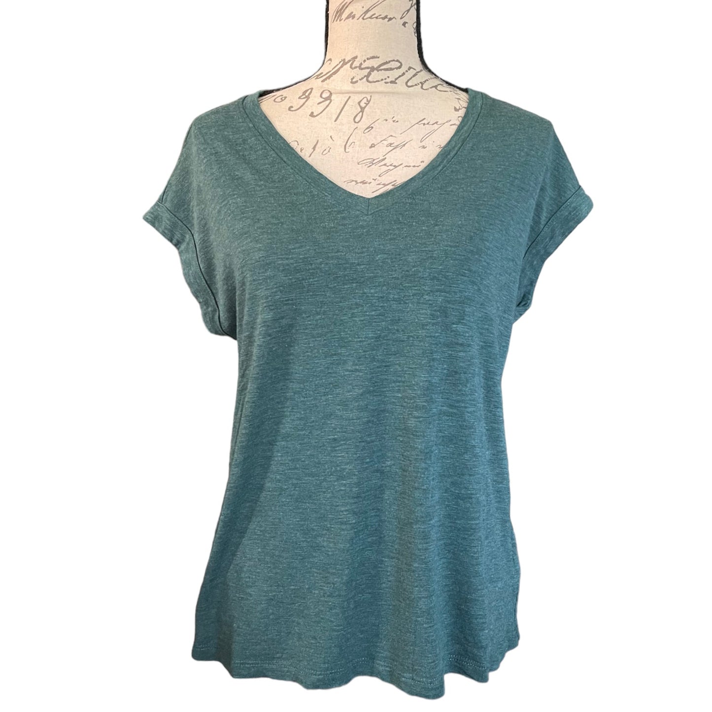 Front of a v neck short sleeve green shirt on a white background