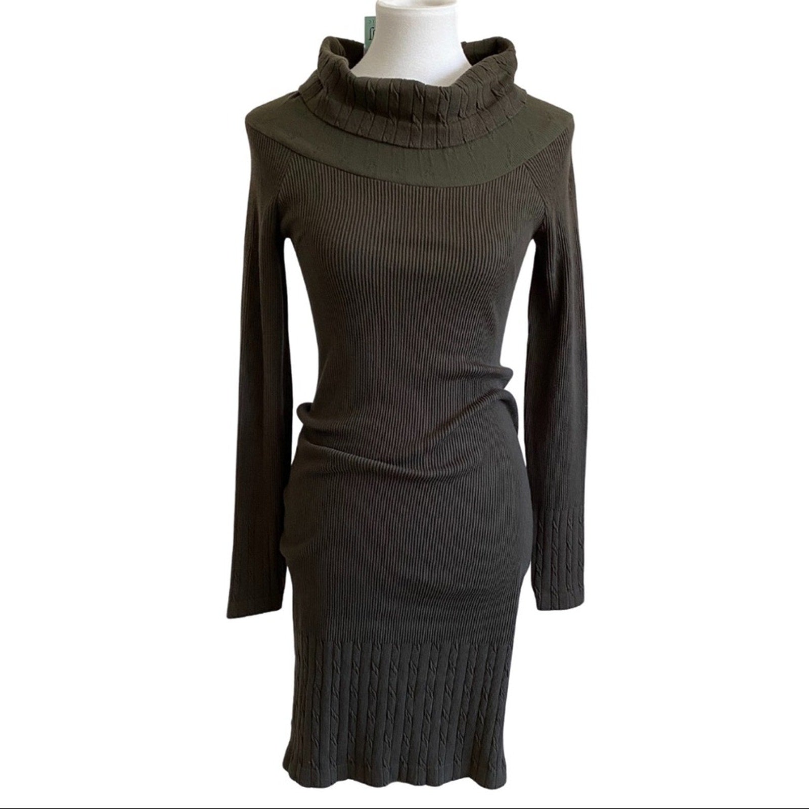 Dark green ribbed knit dress on a mannequin against a white background