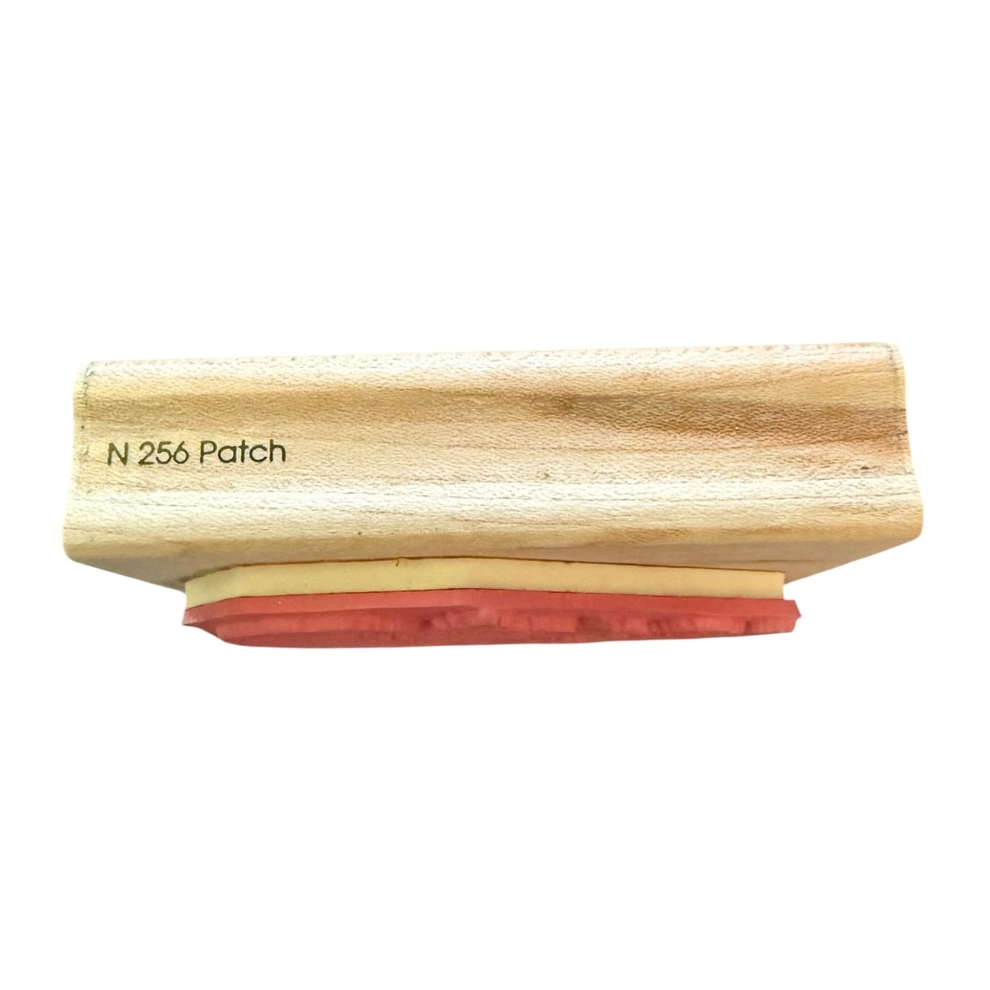 Wooden stamp with red rubber stamp N 256 on a white background