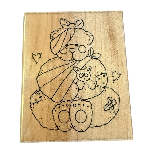 Wooden block with a teddy bear design on a white background