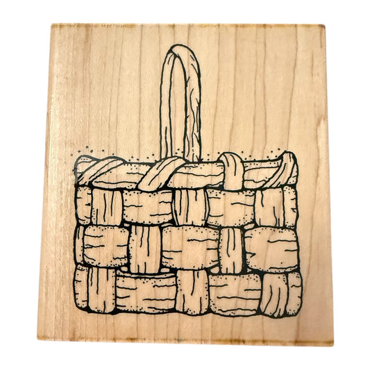 Wood block stamp with a woven basket design with a white background. 