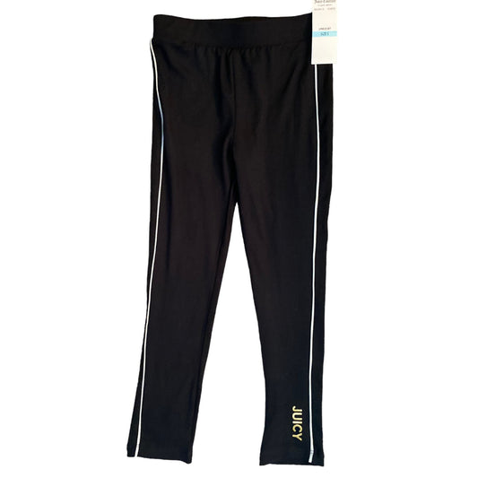 Black Juicy Couture leggings with white side stripes and gold logo text on the lower leg, shown flat on a white background with a tag attached.