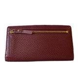 Back of leather wallet with gold zipper on a white background