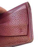 Close-up of a edges of leather wallet with visible texture on a white background