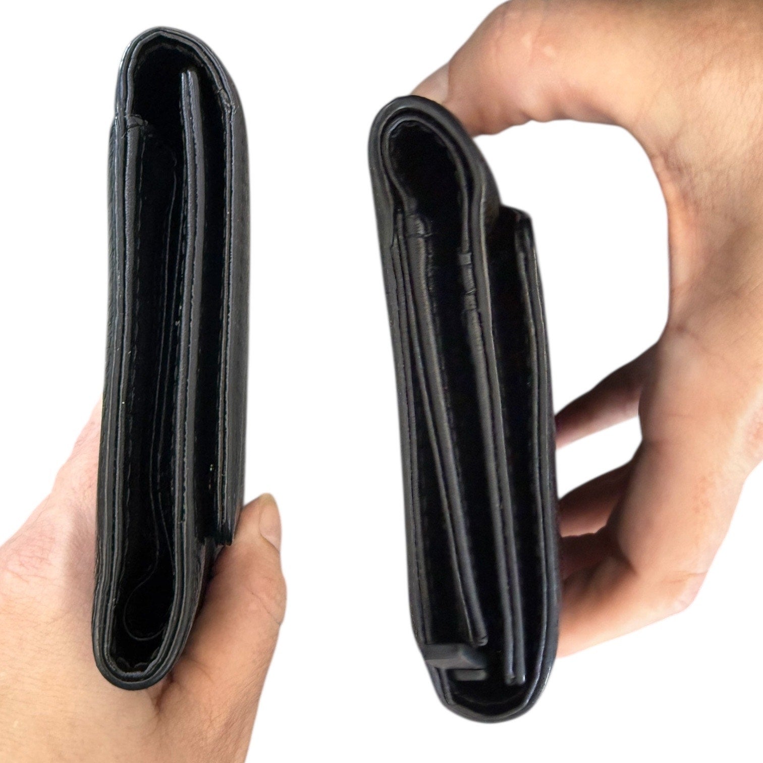 Side view of Black leather wallet held by a hand on a white background