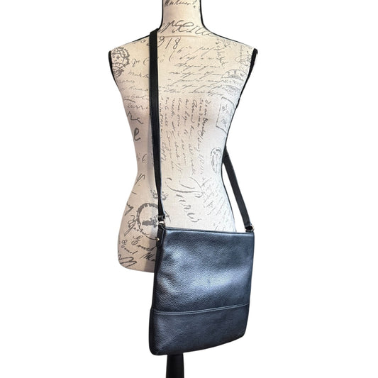 Back of Black leather crossbody bag on a mannequin with a white background
