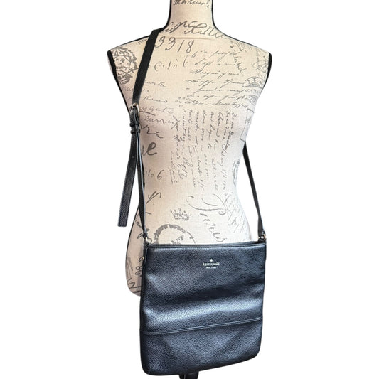 Front of Black leather crossbody bag on a mannequin with a white background