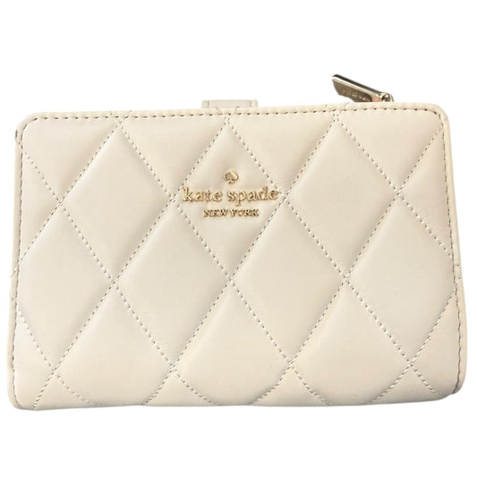 Quilted off white wallet with 'kate spade new york' logo on a white background