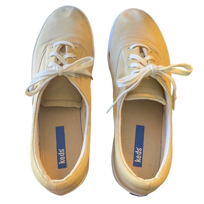 A pair of Keds low-top canvas sneakers shown from a top-down view on a white background. 