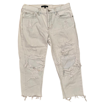 Light blue distressed jeans on a white background