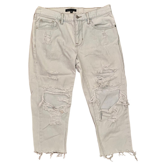 Light blue distressed jeans on a white background