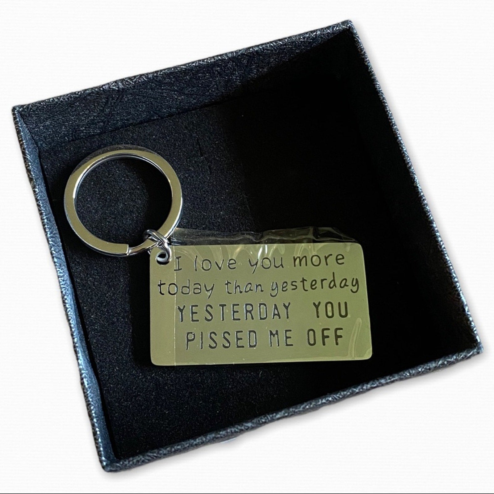 Keychain with engraved message on a black box