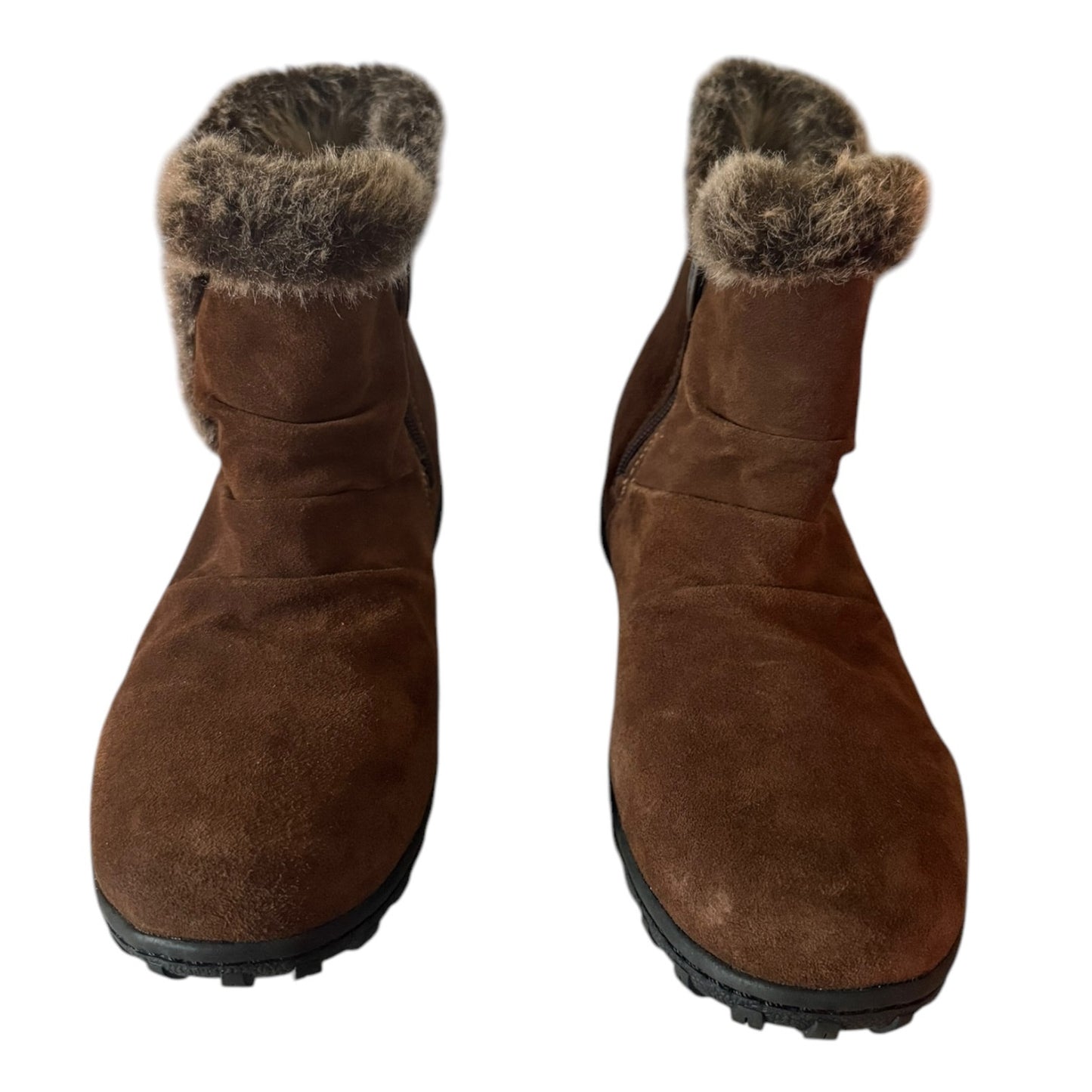 Front of a Pair of brown winter boots with fur trim on a white background