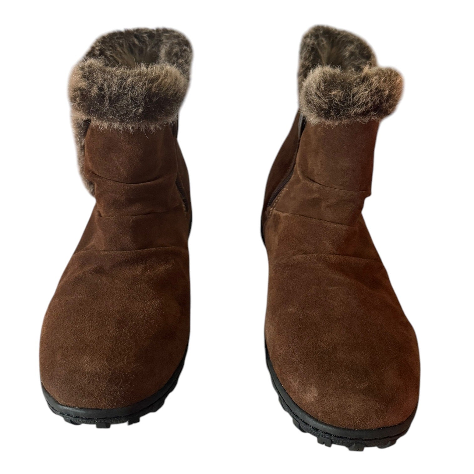 Front of a Pair of brown winter boots with fur trim on a white background