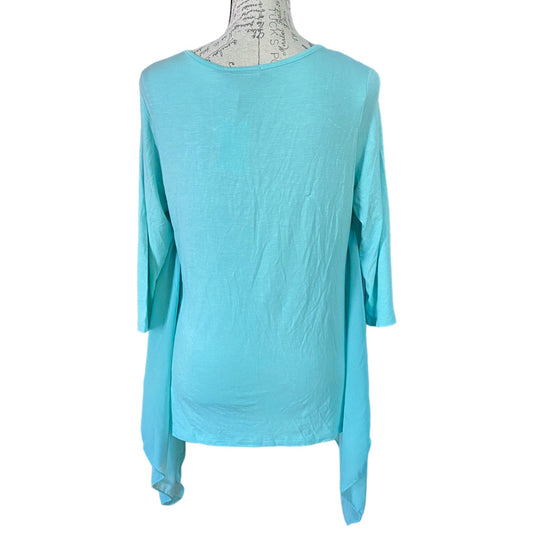 Light blue long-sleeve top on a mannequin against a white background
