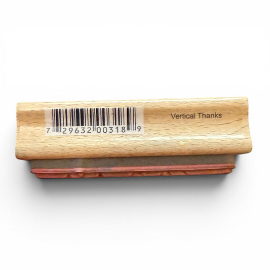Wooden stamp with a barcode and 'Vertical Thanks' text on a white background