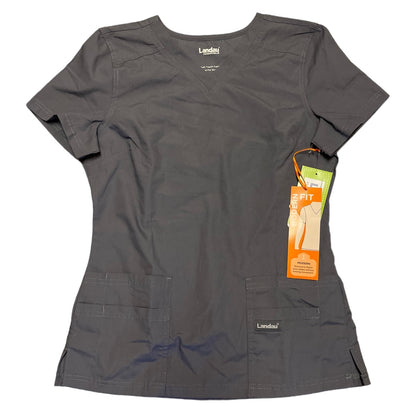 A dark gray scrub top , featuring short sleeves, v neck, and two front pockets, shown with its orange and green retail hangtag against a plain white background.