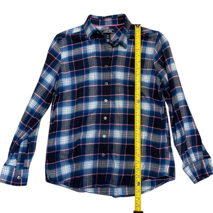 A long-sleeve plaid button-up shirt in navy, blue, white, and pink shown with a yellow tape measure running vertically down the center to indicate size.