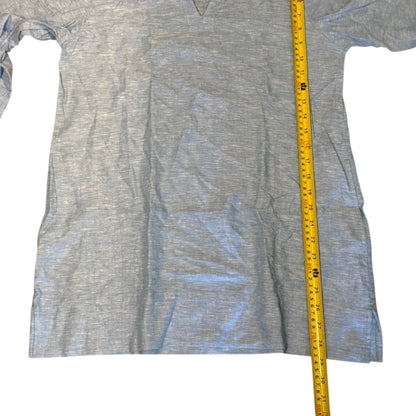Blue shirt with a yellow measuring tape on a white background