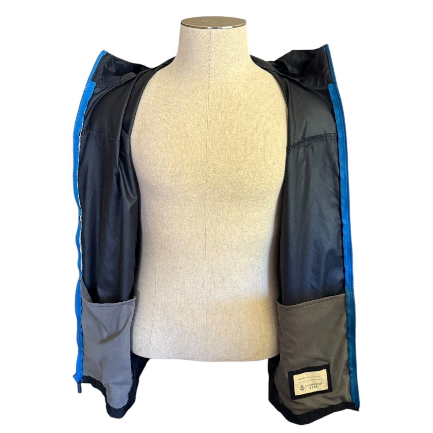 Windbreaker open on a mannequin with a white background