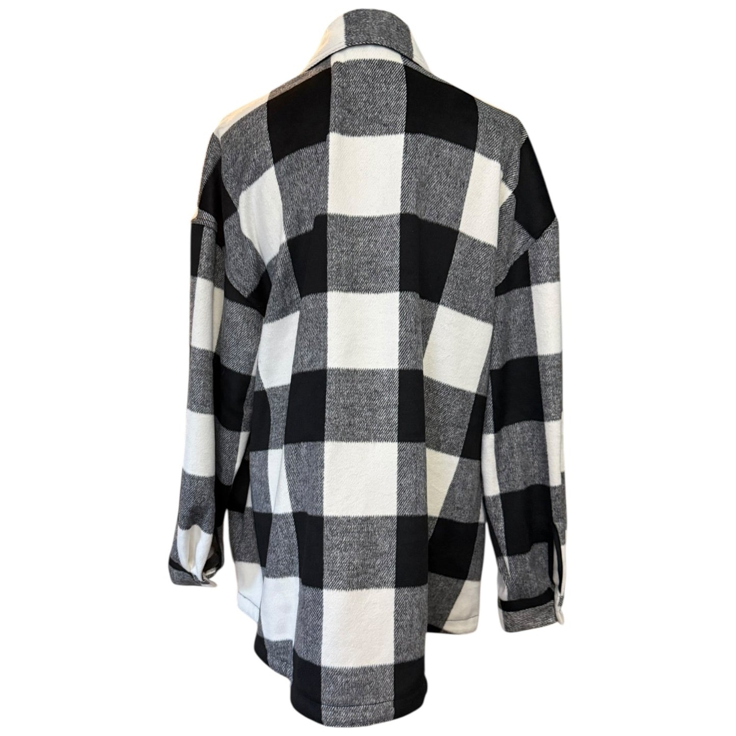 Back of Black and white checkered shacket on a mannequin against a white background