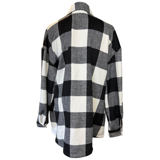 Back of Black and white checkered shacket on a mannequin against a white background
