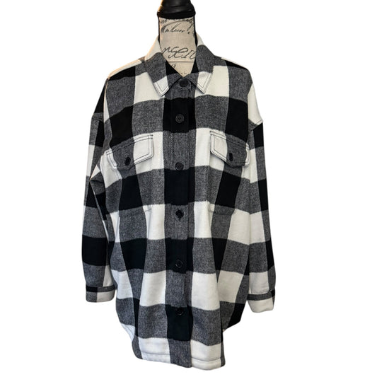 Front of Black and white checkered flannel shacket on a mannequin against a white background