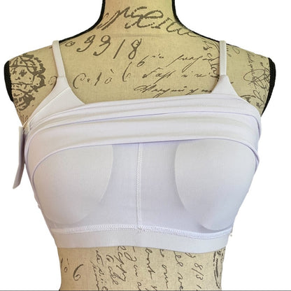 White seamless underwire bra displayed on a vintage-style paper dress form mannequin against a white background.
