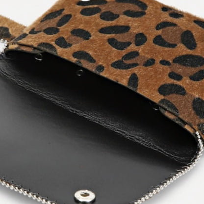 Leopard print bag with black interior and silver chain strap
