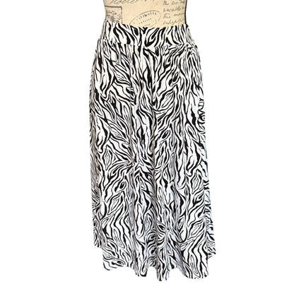 Black and white zebra print skirt on a mannequin against a white background